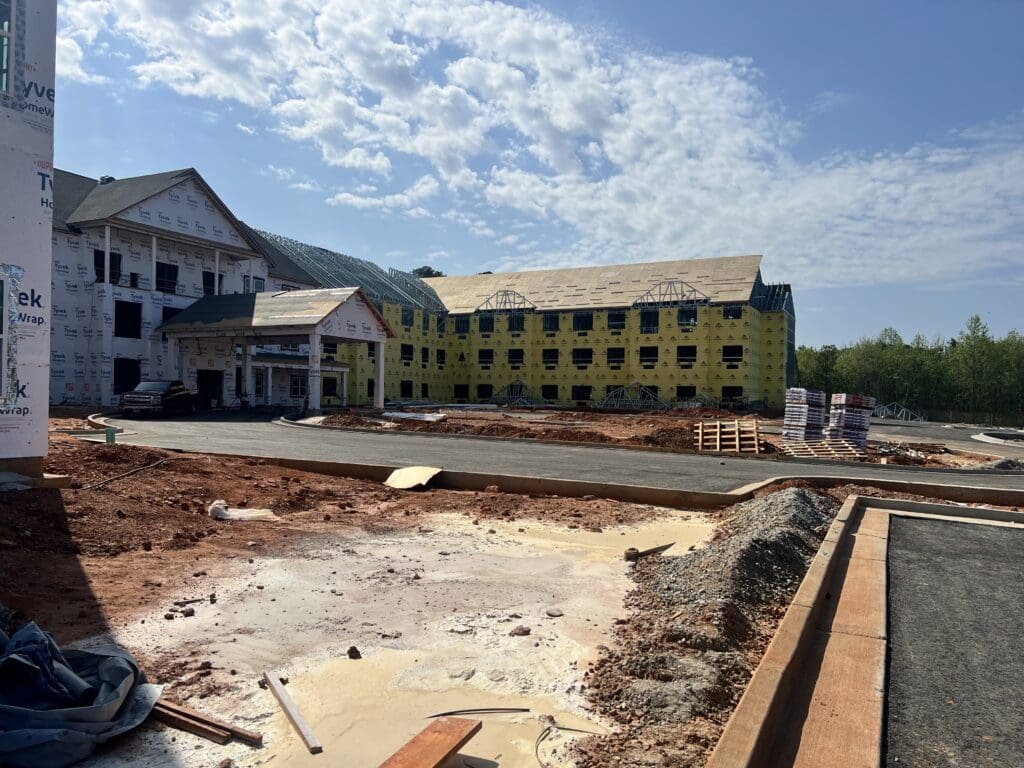 community buildings under construction, including view of roads
