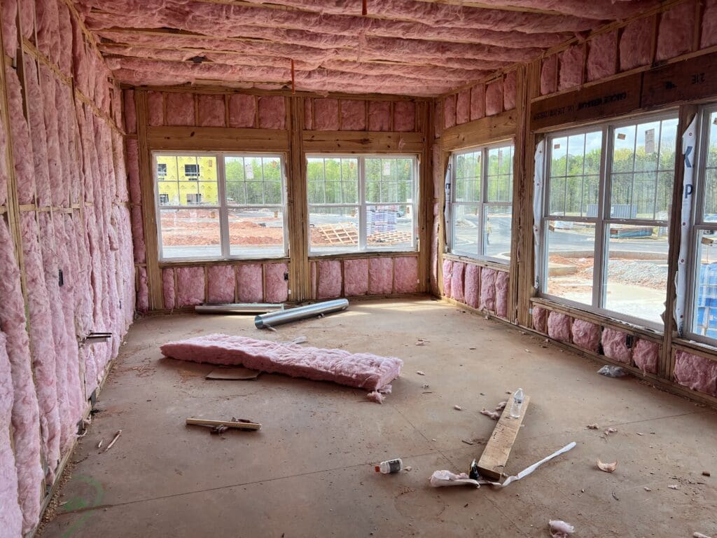 room under construction with insulation and windows